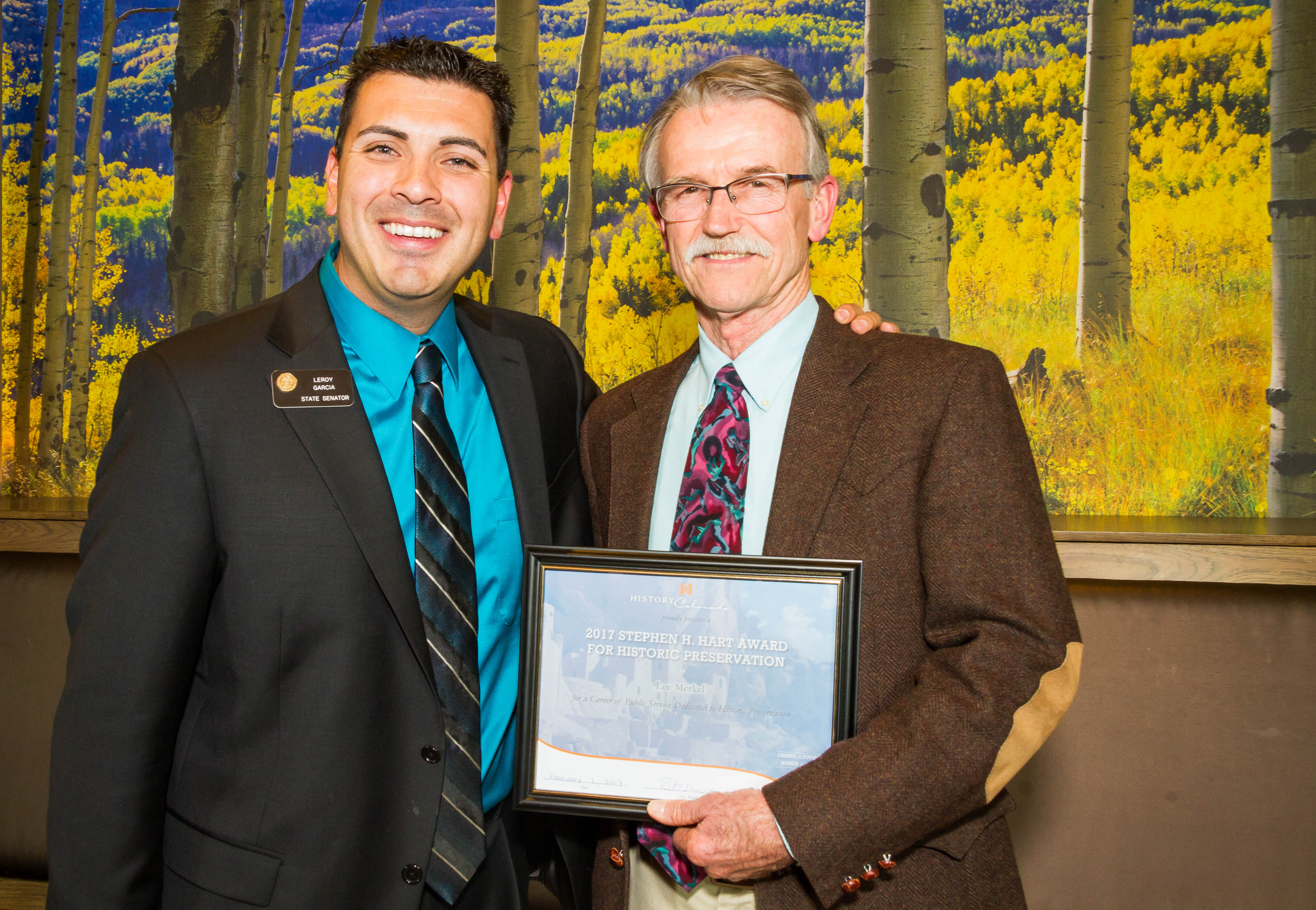 State Senator Leroy Garcia stands next to Lee Merkel, who is holding his recently received Hart Award certificate.